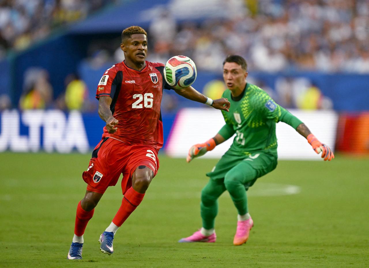 Cape Verde's forward #26 Helio Varela scores his team's second goal past Uruguay's goalkeeper #23 Fernando Muslera during the 2026 World Cup Group H football match at the Miami Stadium in Miami Gardens, FL, on June 21, 2026.  (AFP Photo)