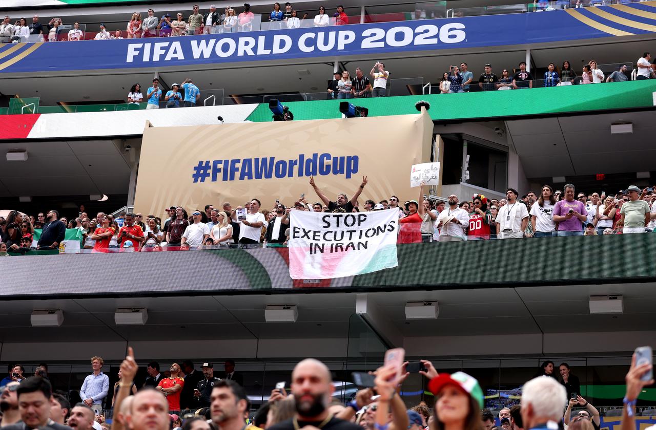 Fans holds the banner reading 'Stop Execution in Iran' before the FIFA World Cup 2026 Group G match between Belgium and IR Iran at Los Angeles Stadium in Inglewood, California, US, June 21, 2026, . (AFP Photo)