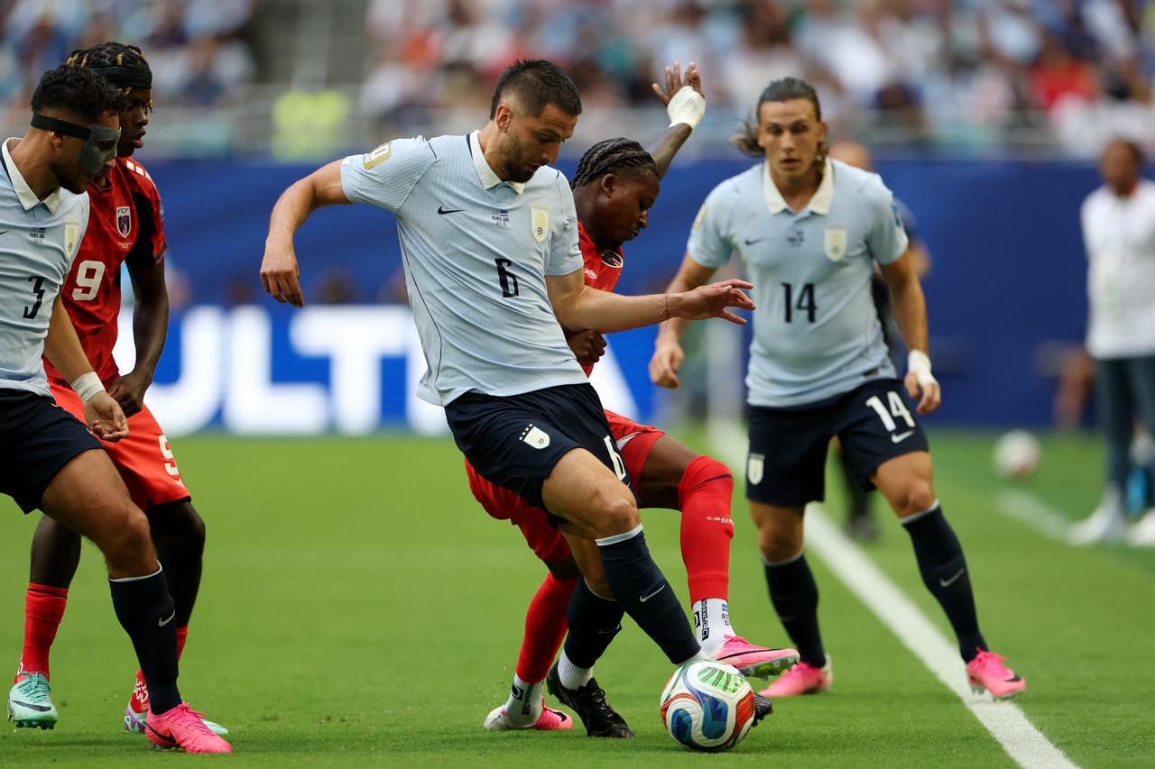Uruguay's midfielder #06 Rodrigo Bentancur and Cape Verde's defender #13 Sidney Lopes Cabral fight for the ball during the 2026 World Cup Group H football match between Uruguay and Cape Verde at the Miami Stadium in Miami Gardens, June 21, 2026. (AFP Photo)