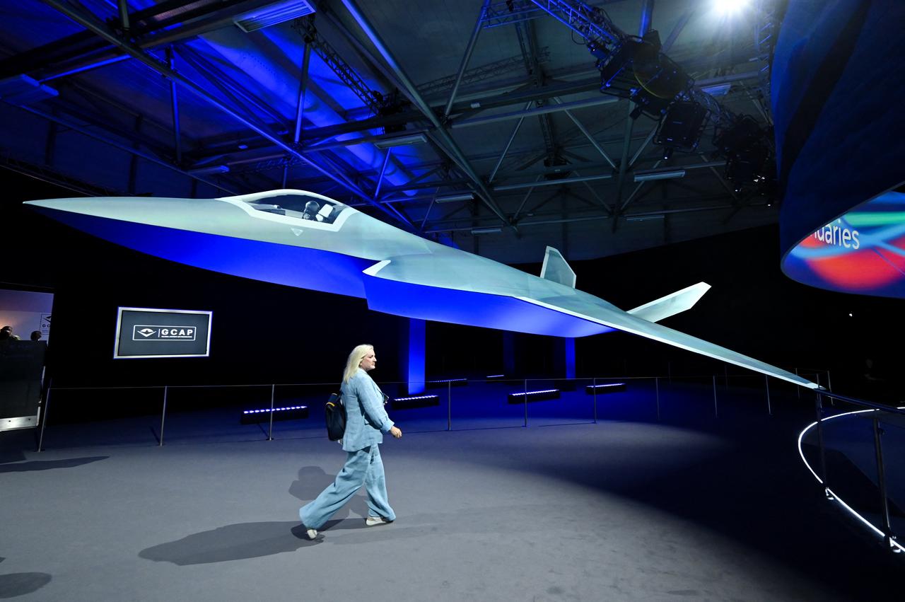A person walks past the Global Combat Air Programme (GCAP) 6th generation fighter jet concept design at the Farnborough International Airshow 2024, London, July 22, 2024. (AFP Photo)