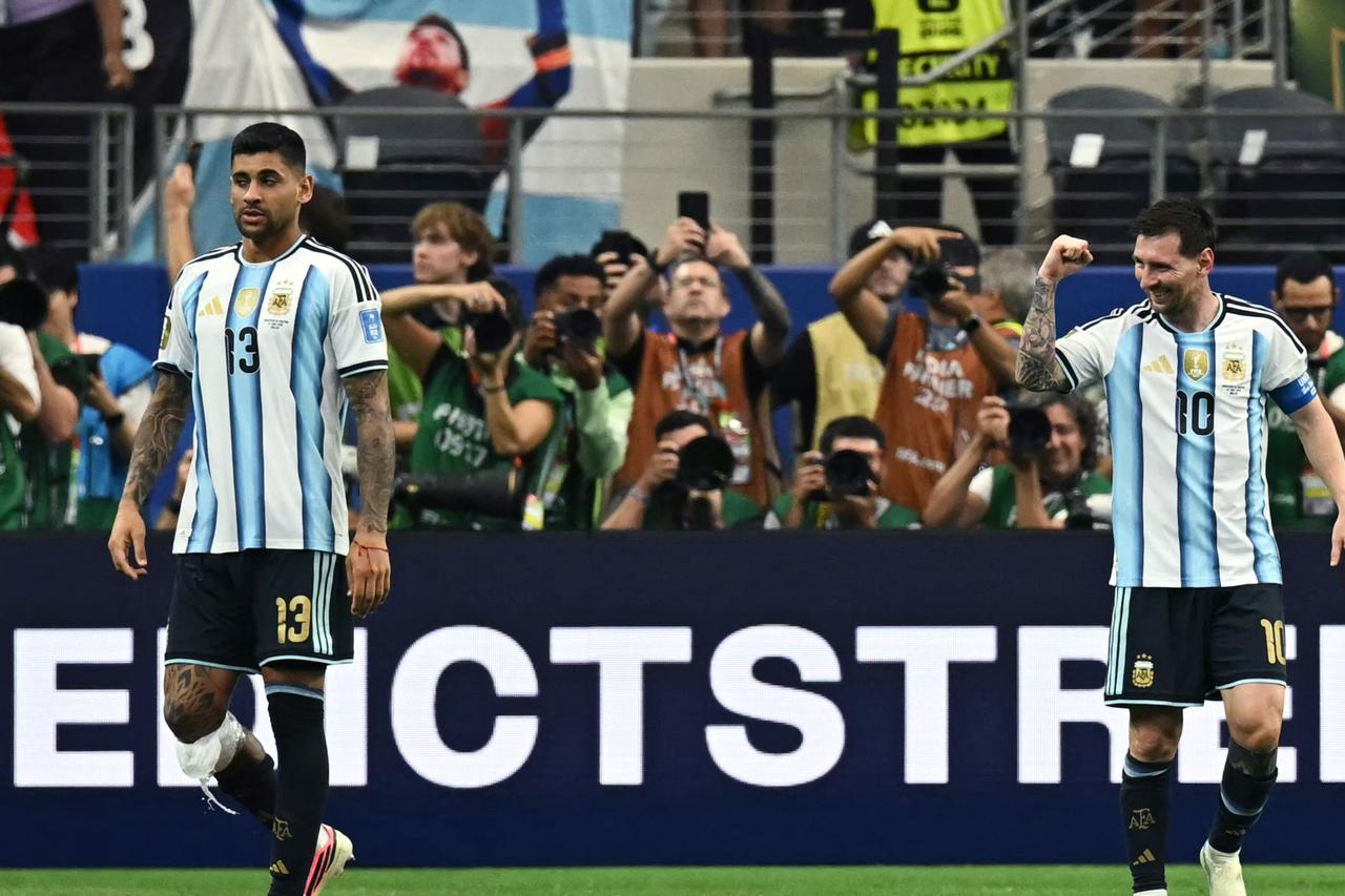 Messi breaks World Cup scoring record as Argentina reach last 32
