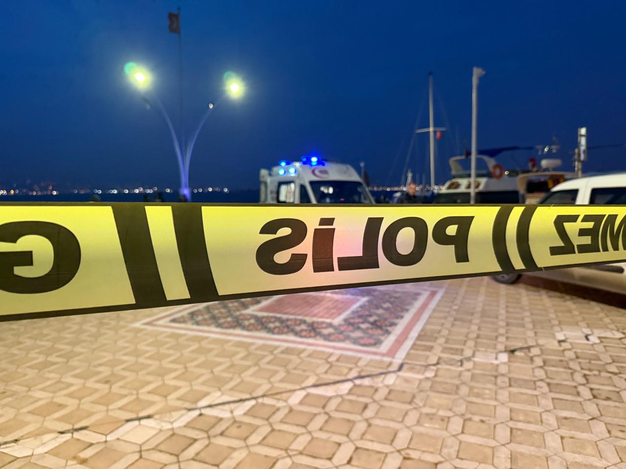 The photo shows a police tape surrounding the area where a dead Romanian diver was found in Kocaeli's Basiskele district, Türkiye, on Jan. 24, 2026. (IHA Photo)
