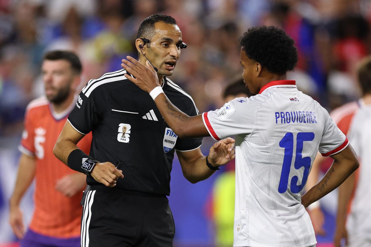 Referee Mustapha Ghorbal speaks to Ruben Providence #15 of Haiti during the FIFA World Cup 2026 Group C match between Haiti and Scotland at Boston Stadium in Foxborough, Massachusetts, US, June 13, 2026. (AFP Photo)