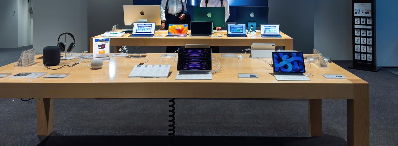Apple products are displayed at a retail store. (Adobe Stock Photo)
