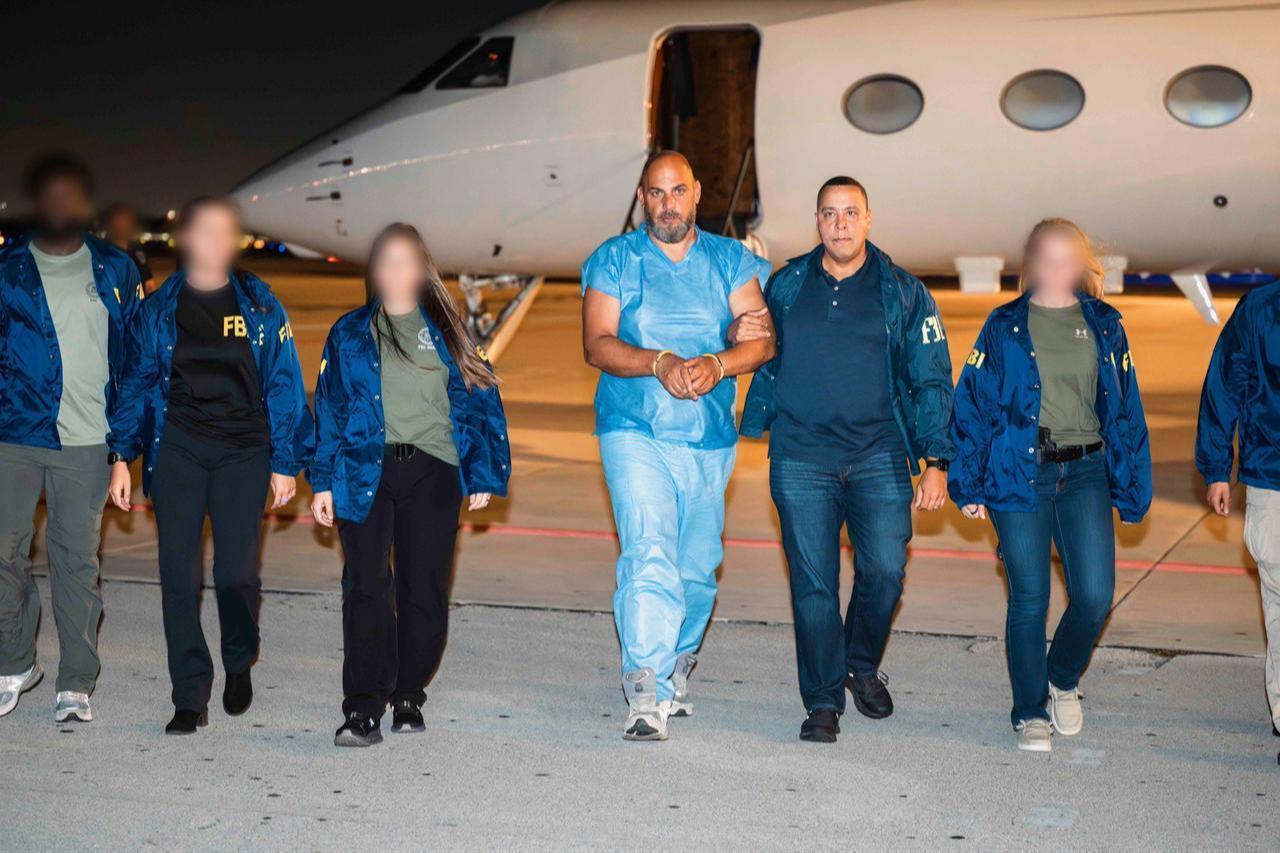 Photo shows the Ibrahim Khaldoon Hilmi, who is charged with one of the biggest Medicare scams in history, being escorted by FBI officials during his arrival in South Florida, US, June 2026. (Photo via X/@FBIDirectorKash)