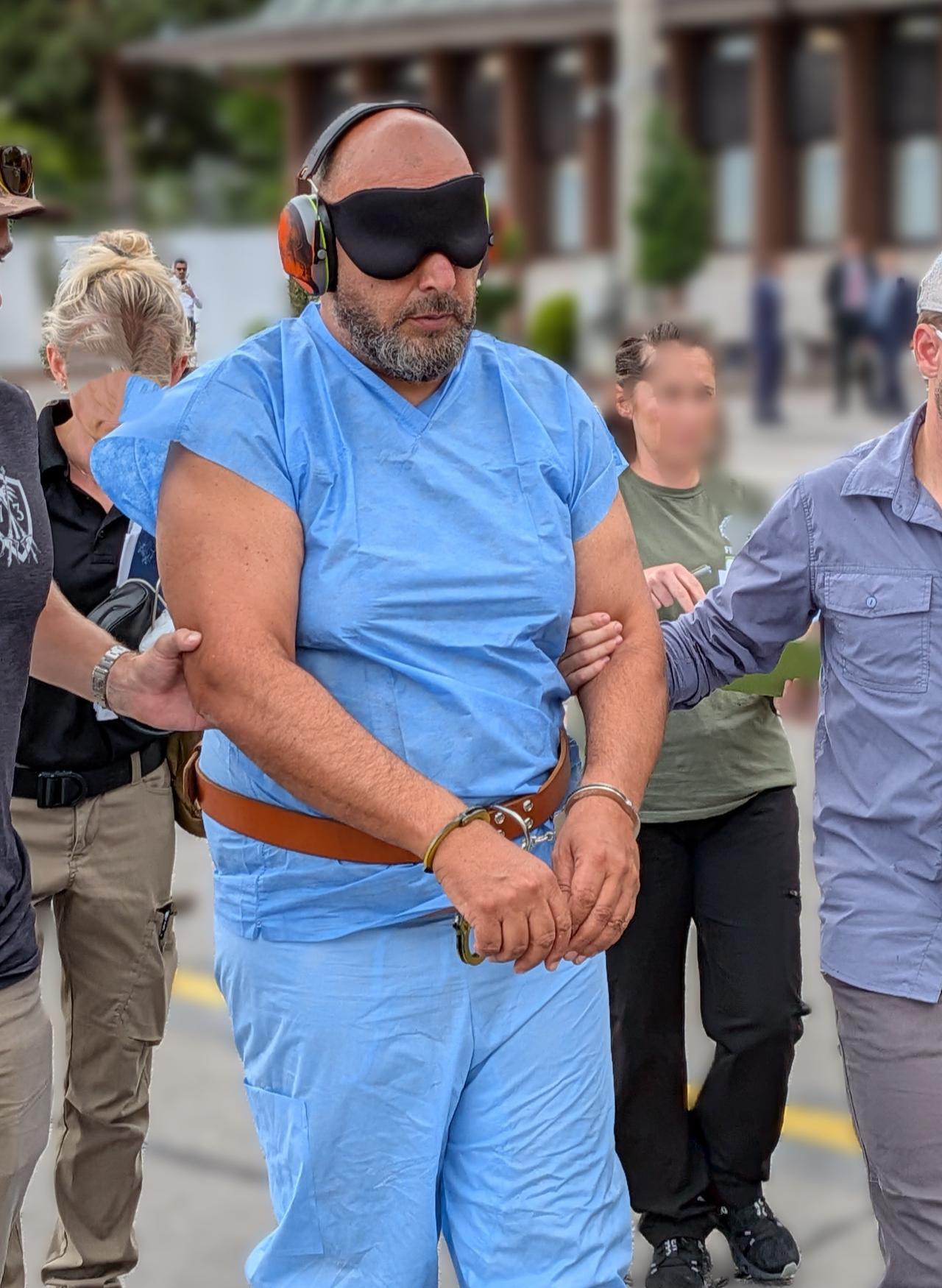 Photo shows the Ibrahim Khaldoon Hilmi, who is charged with one of the biggest Medicare scams in history, being escorted by FBI officials during his arrival in South Florida, US, June 2026. (Photo via X/@FBIMiamiFL)