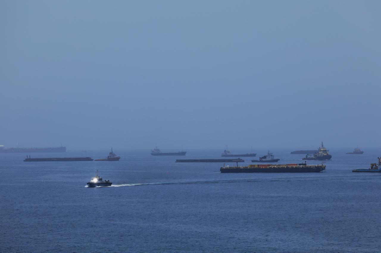 A view of commercial cargo vessels and crude oil tankers are anchored in the Gulf of Oman, off the coast of Muscat, Oman,  June 21, 2026. (AA Photo)