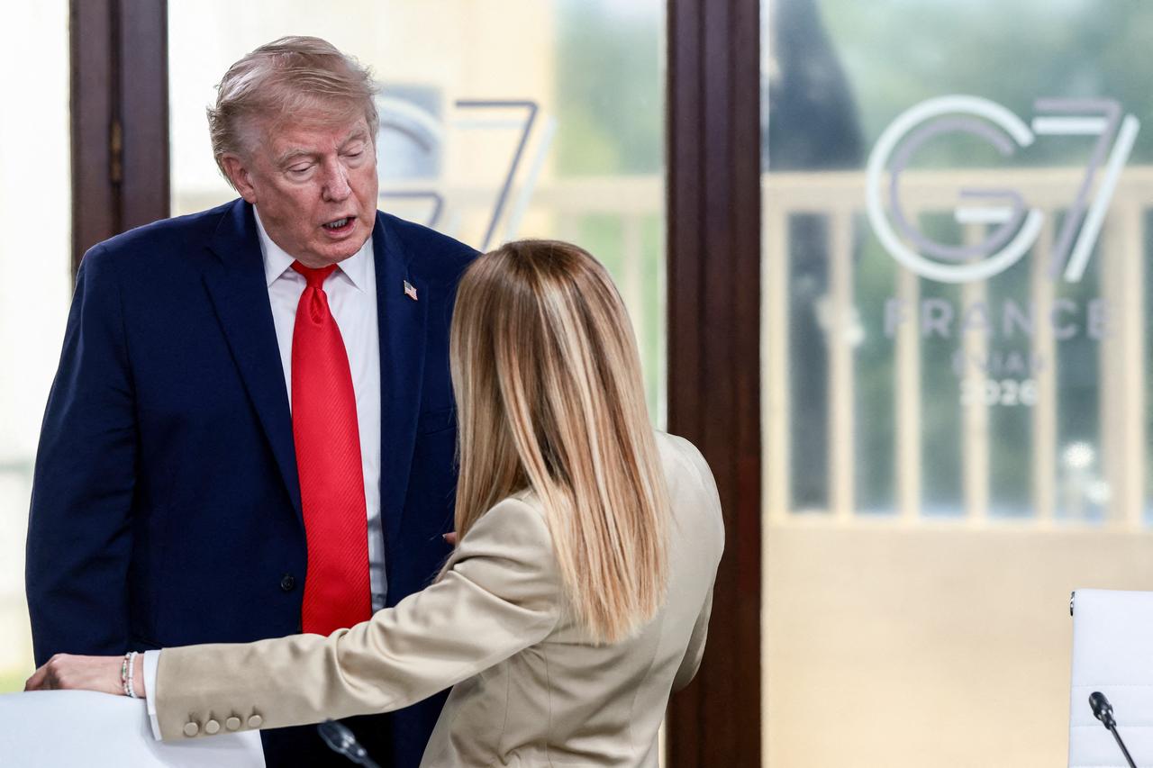 US President Donald Trump speaks with Italy's Prime Minister Giorgia Meloni during a work lunch as part of the G7 summit, in Evian, eastern France, June 16, 2026. (AFP Photo)