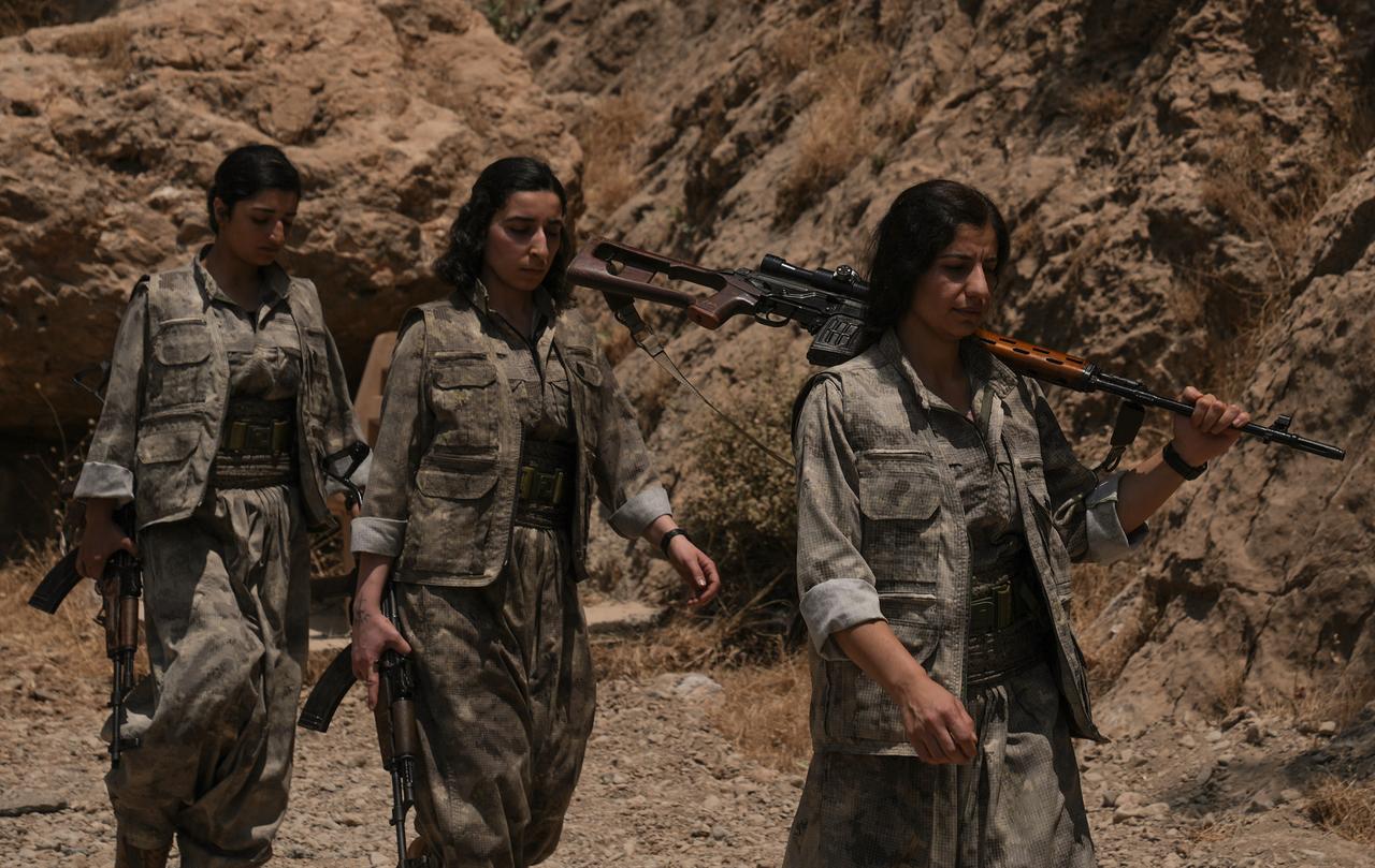 The first group of PKK terrorists lays down and destroys their weapons in Sulaymaniyah, northern Iraq on July 11, 2025. (AA Photo)