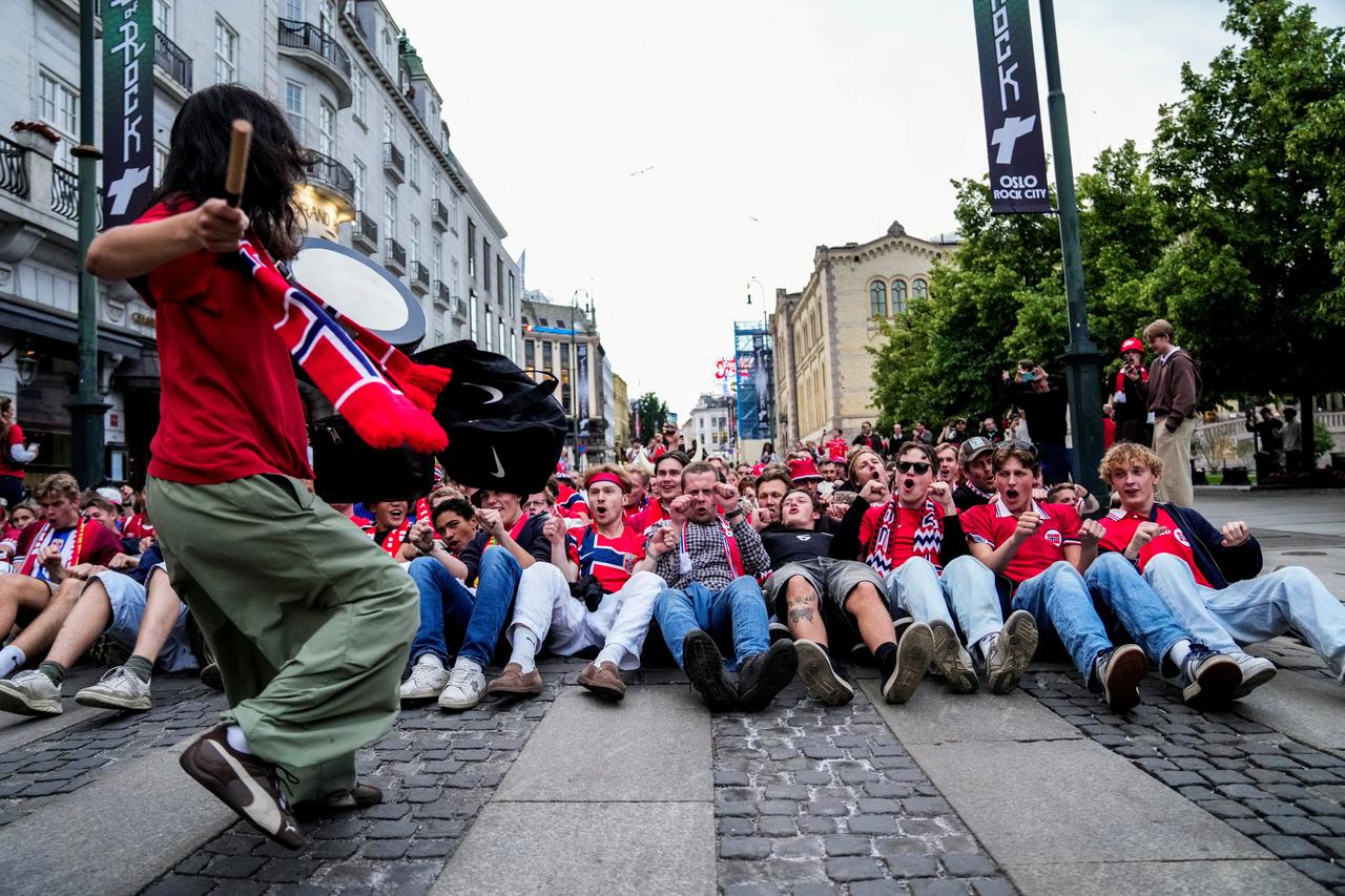 Norwegian supporters cheer as the make the "Viking rowing" action in the streets of Oslo, on June 23, 2026 after Norway's 2026 World Cup football tournament Group I match against Senegal. (AFP Photo)