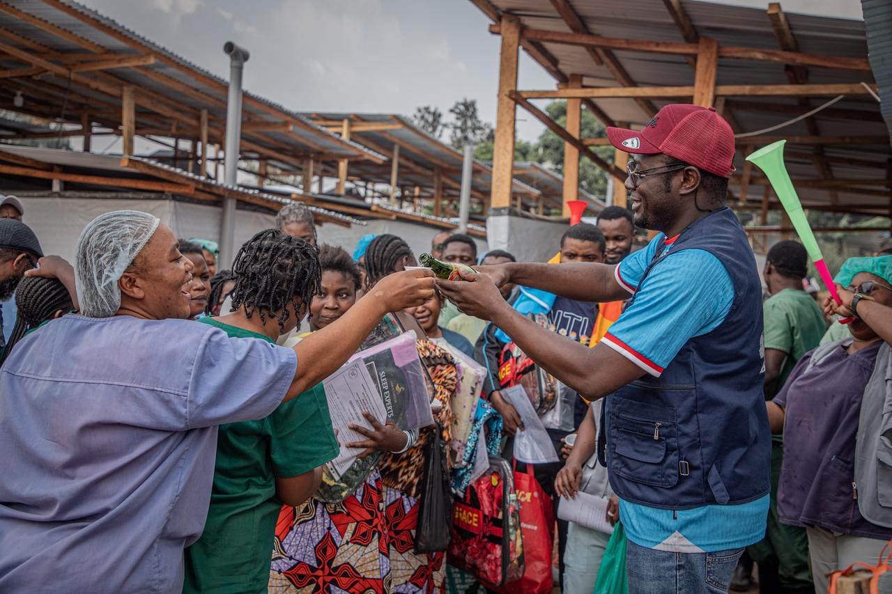 Healthcare workers celebrate with survivors of Ebola virus disease as they leave hospital, after being declared cured, in Ituri, eastern DRC, at the Ebola Treatment Center (CTE) of the Evangelical Medical Center (CME), June 23, 2026. (AFP Photo)