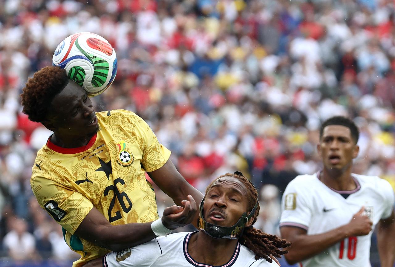 Ghana's defender #26 Marvin Senaya (L) fights for the ball with England's defender #25 Djed Spence during the 2026 World Cup Group L football match between England and Ghana at the Boston Stadium in Foxborough on June 23, 2026. (AFP Photo)
