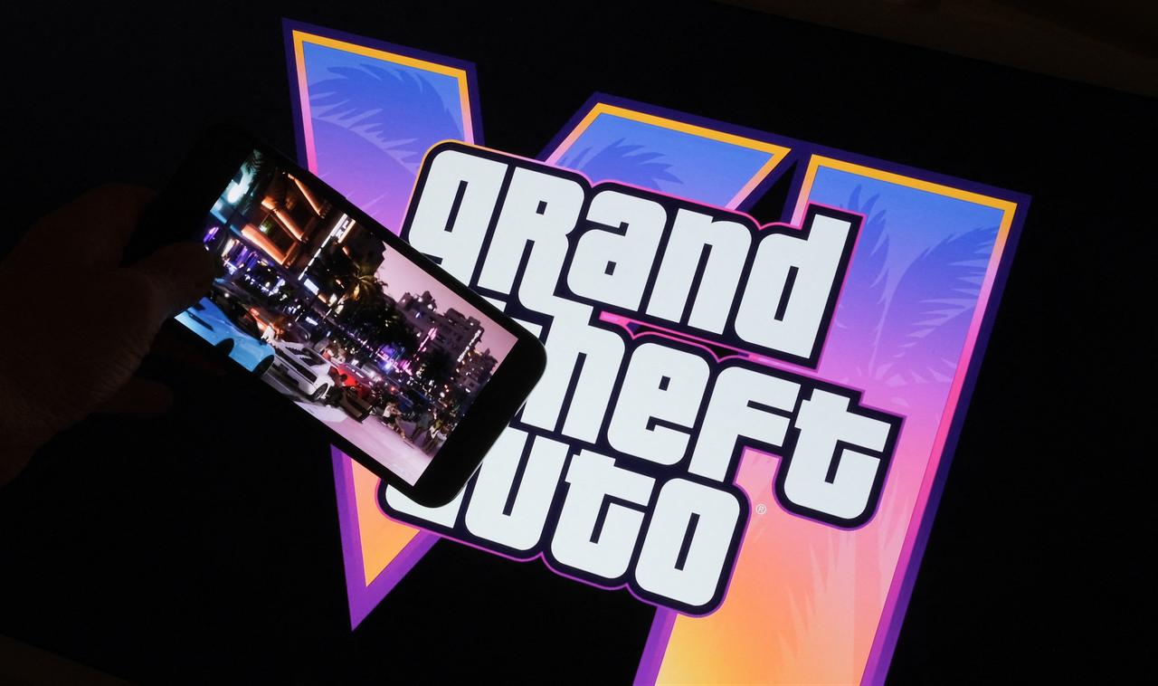 This illustration photo created in Los Angeles, December 4, 2023, shows Rockstar Games’ Grand Theft Auto VI trailer played on a screen in front of the game title.  (AFP Photo)