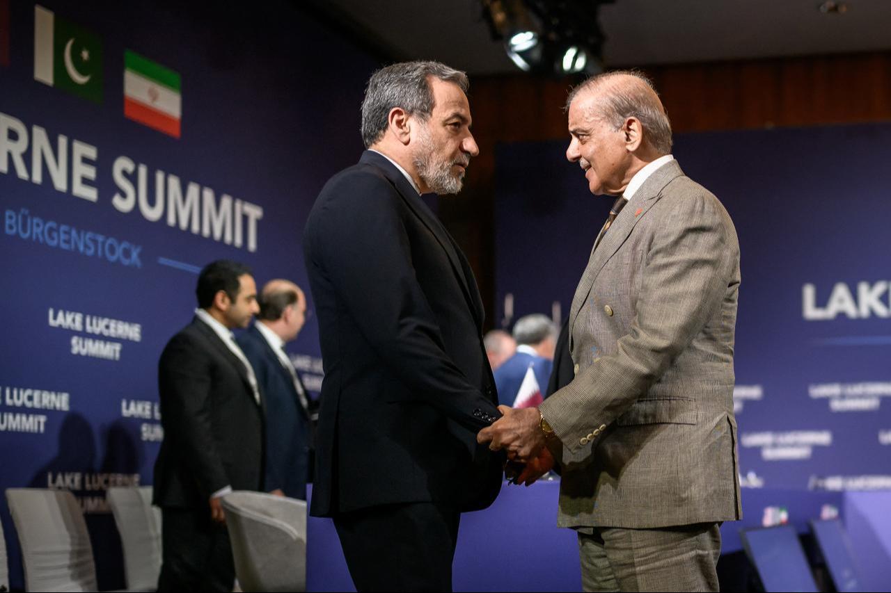 Iran's Foreign Minister Abbas Araghchi (L) shakes hands with Pakistan's Prime Minister Shehbaz Sharif ahead of a quadrilateral meeting in Switzerland, June 21, 2026. (AFP Photo)