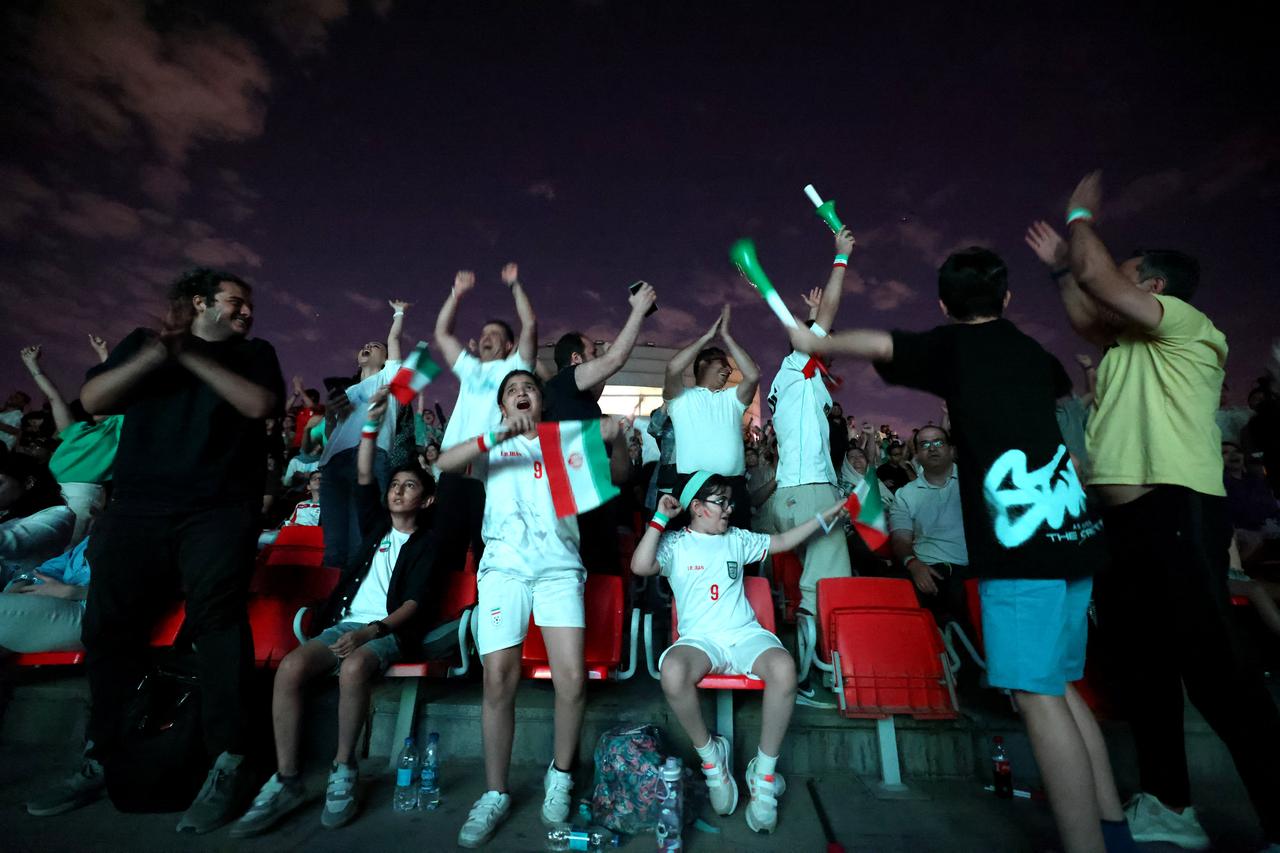 Iranian soccer fans cheer as they watch a broadcast of the 2026 World Cup Group G football match between Belgium and Iran in Tehran, Iran, on June 21, 2026. (AFP Photo)