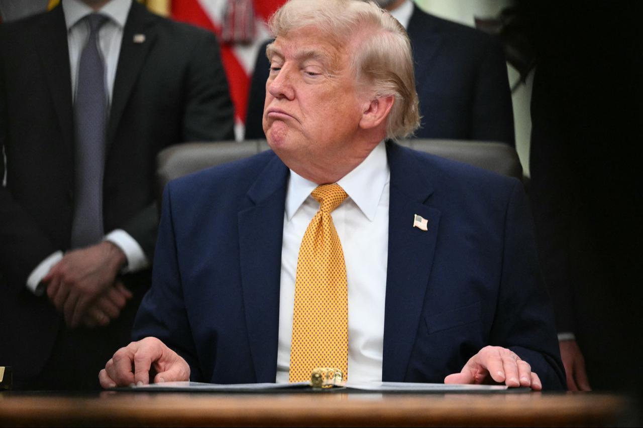 US President Donald Trump looks on after signing an executive order in the Oval Office of the White House in Washington, DC, June 22, 2026. (AFP Photo)