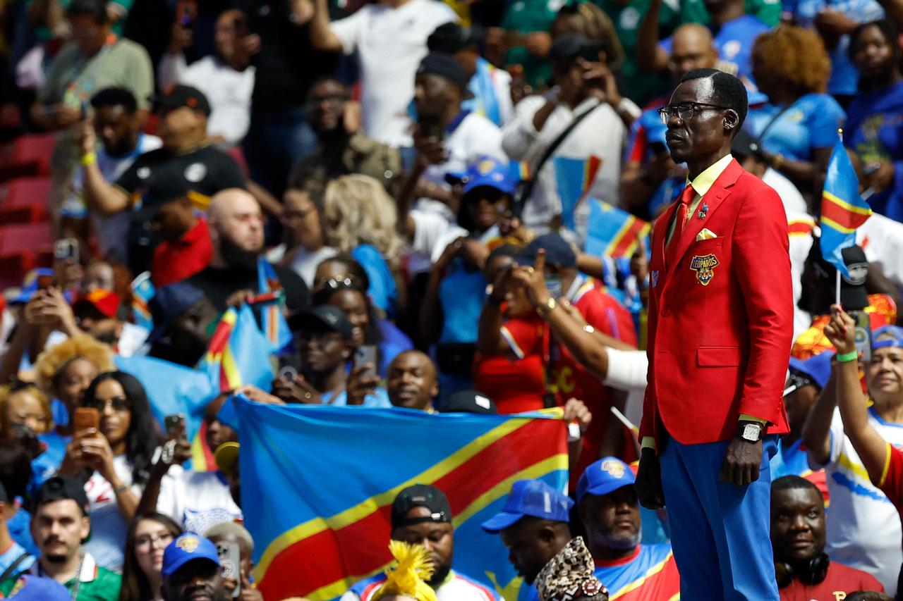 Stone-faced DR Congo fan draws attention during Colombia World Cup match