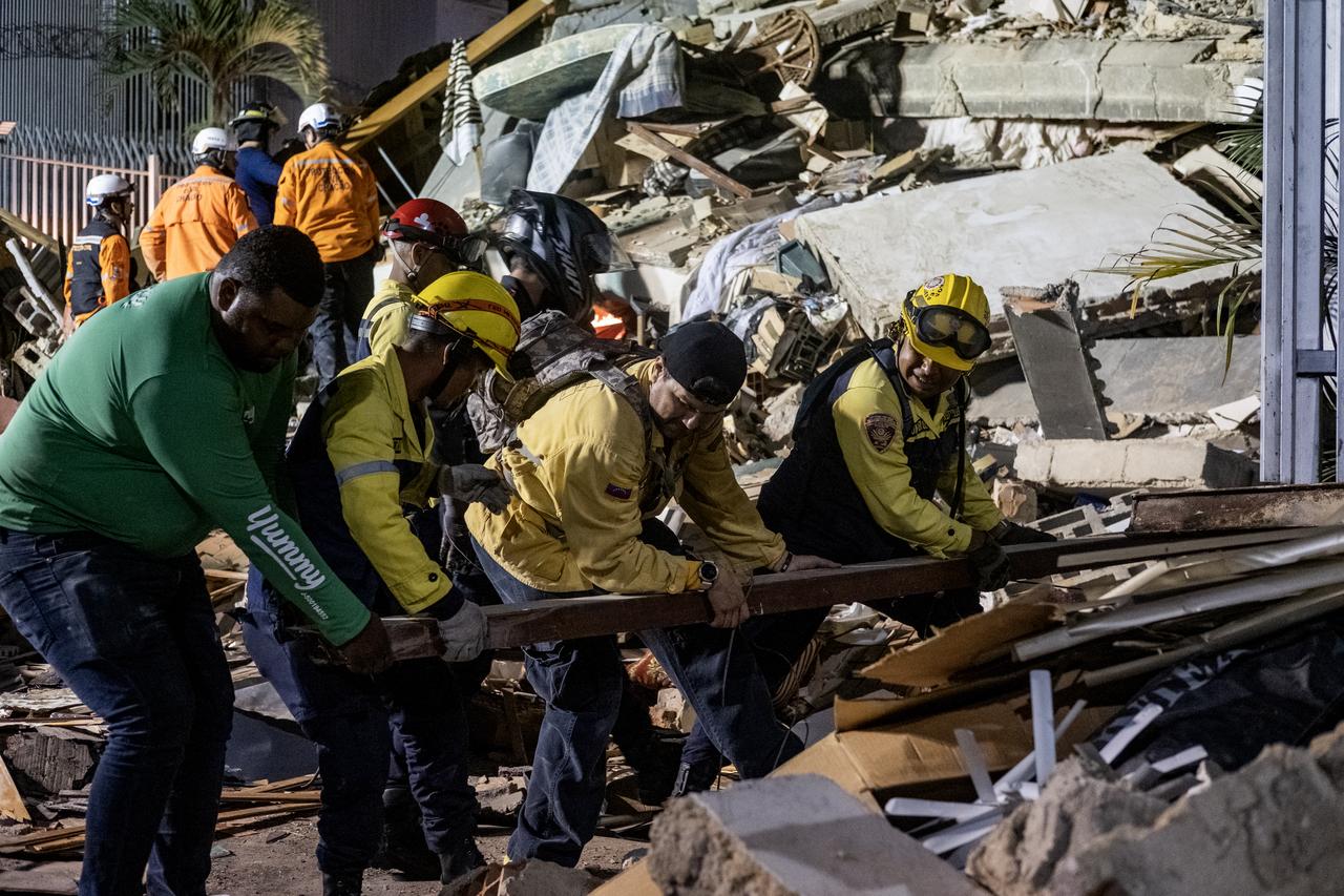 Rescue workers search through the rubble of a collapsed building following a powerful earthquake in Caracas, Venezuela, on June 24, 2026. (AA Photo)
