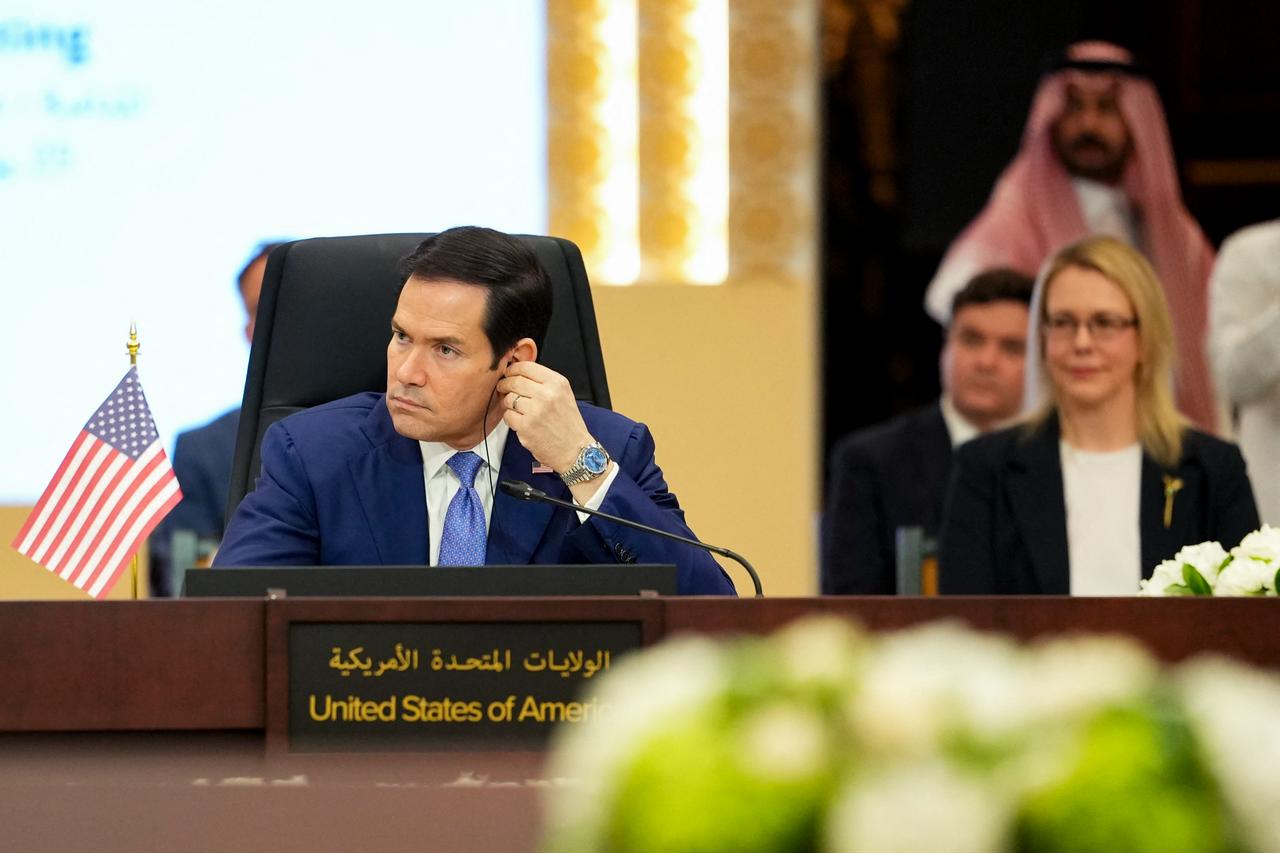US Secretary of State Marco Rubio adjusts his ear piece during a meeting with foreign ministers of the Gulf Cooperation Council Member States during his visit to the Middle East to discuss the interim deal between the US and Iran with Arab Gulf allies, in Manama on June 25, 2026. (AFP Photo)