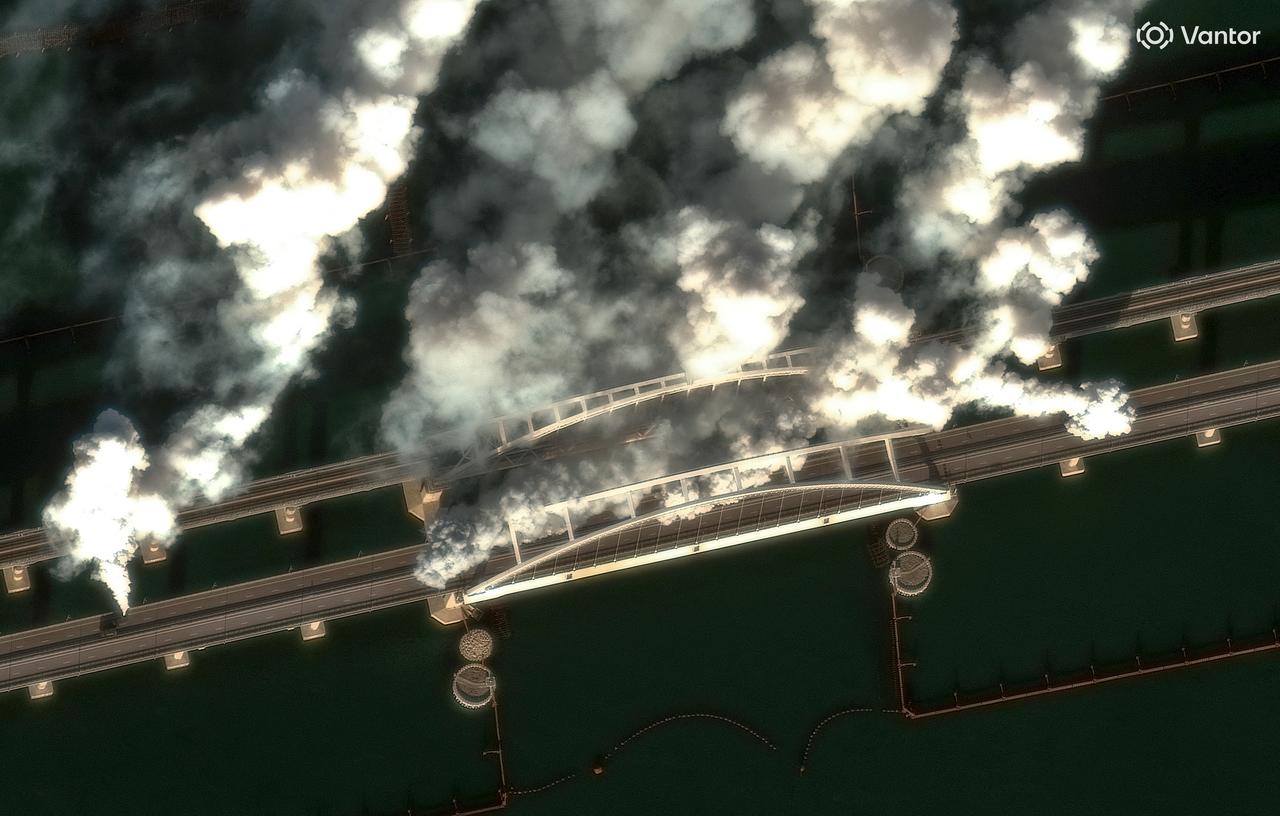 This handout satellite image courtesy of 2026 Vantor taken on June 22, 2026 and made available on June 23, 2026, shows smoke generators on Crimea Bridge, also called Kerch Strait Bridge, which spans the Kerch Strait, in Kerch. (Photo by Handout / Satellite image ©2026 Vantor / AFP)