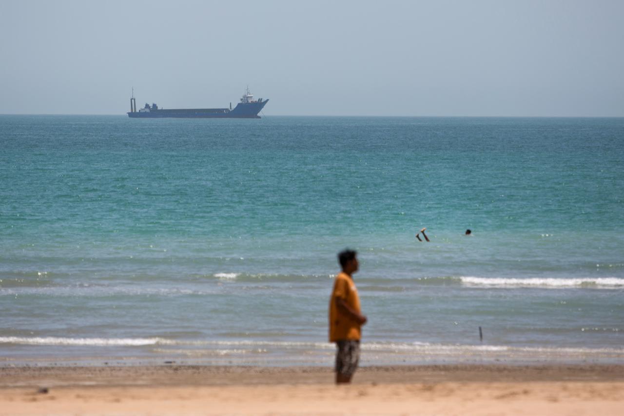 Iranian commercial ships are seen off the coast of Kong city in southern Iran on June 21, 2026. (AA Photo)