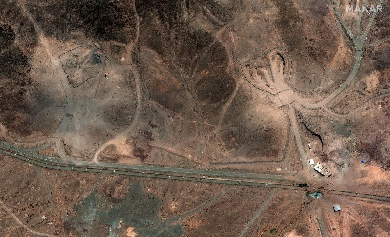 This handout satellite picture taken on June 24, 2025, shows new airstrike craters at the entrance of Iran's Fordow Fuel Enrichment Plant (FFEP), northeast of the city of Qom. (Photo by Satellite image ©2025 Maxar Technologies/AFP)