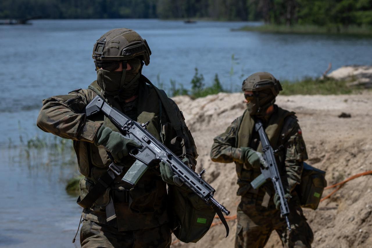 Polish soldiers are seen, as troops from Poland and Lithuania take part in the "Bursztynowy Obronca-26" (Amber Defender) military exercise on the Orzysz military training ground, north-eastern Poland, June 24, 2026. (AFP Photo)