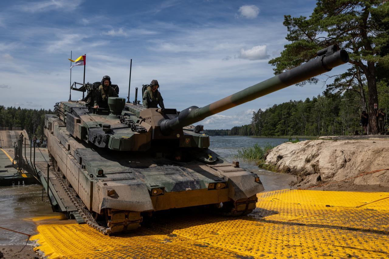 A Polish Army Korean-made K2 tank is seen on a PFM Motorized Floating Bridge during a lake crossing in the "Bursztynowy Obronca-26" military exercise, north-eastern Poland, June 24, 2026. (AFP Photo)