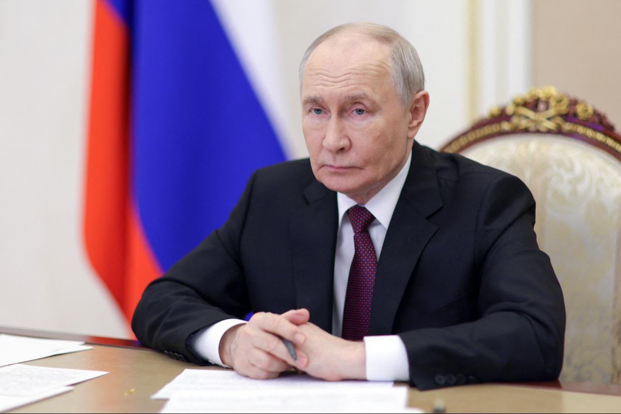 In this pool photograph distributed by the Russian state agency Sputnik, Russia's President Vladimir Putin chairs a meeting with members of the government via videoconference in Moscow, June 23, 2026. (Photo via Sputnik/HO/AFP Photo)