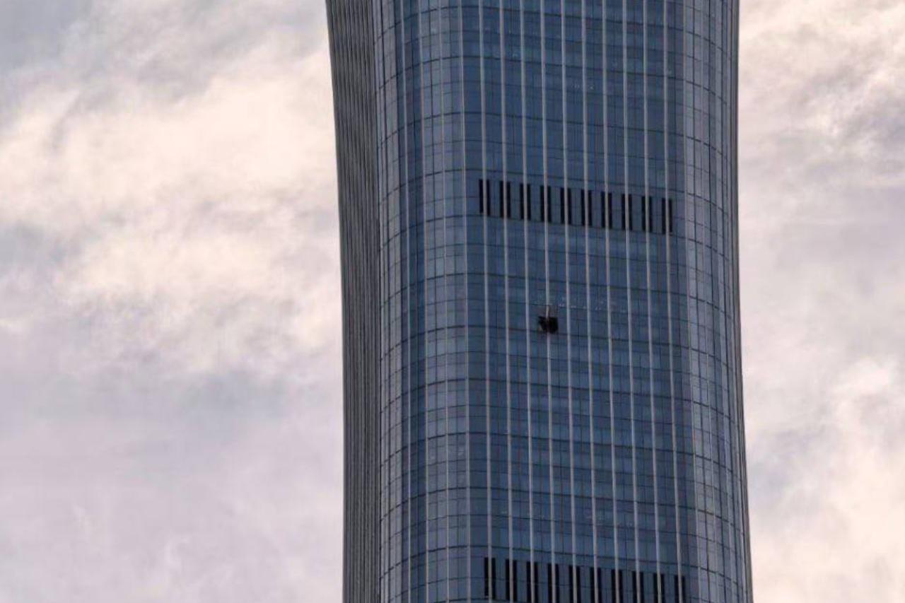 Small plane crashes into Beijing's tallest tower as police close roads