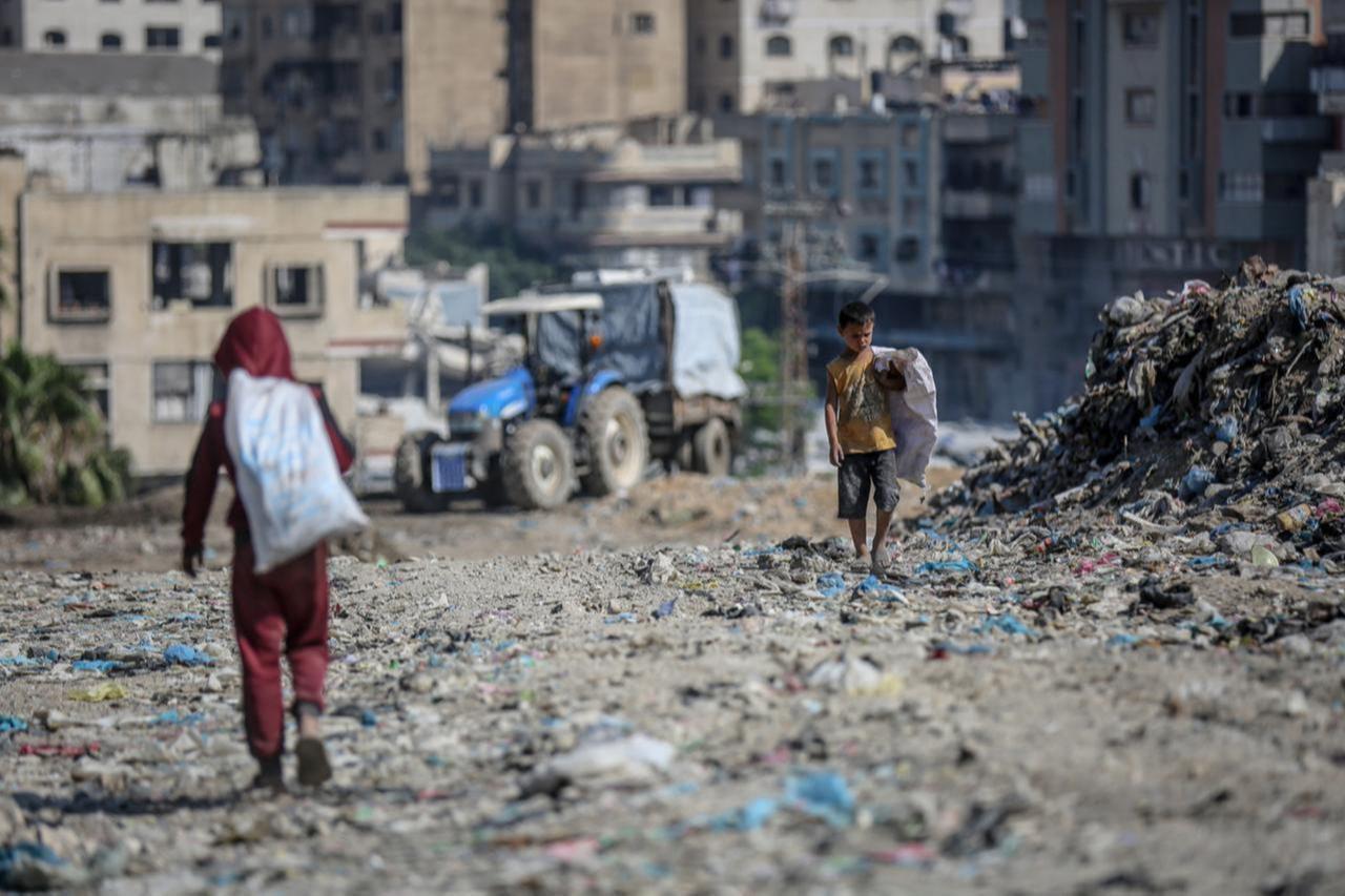 Gazan children are seen as teams under the United Nations Development Programme (UNDP) continue cleanup operations using heavy machinery at one of the city’s largest landfill sites posing a public health risk in Gaza, Palestine, June 02, 2026. (AA Photo)