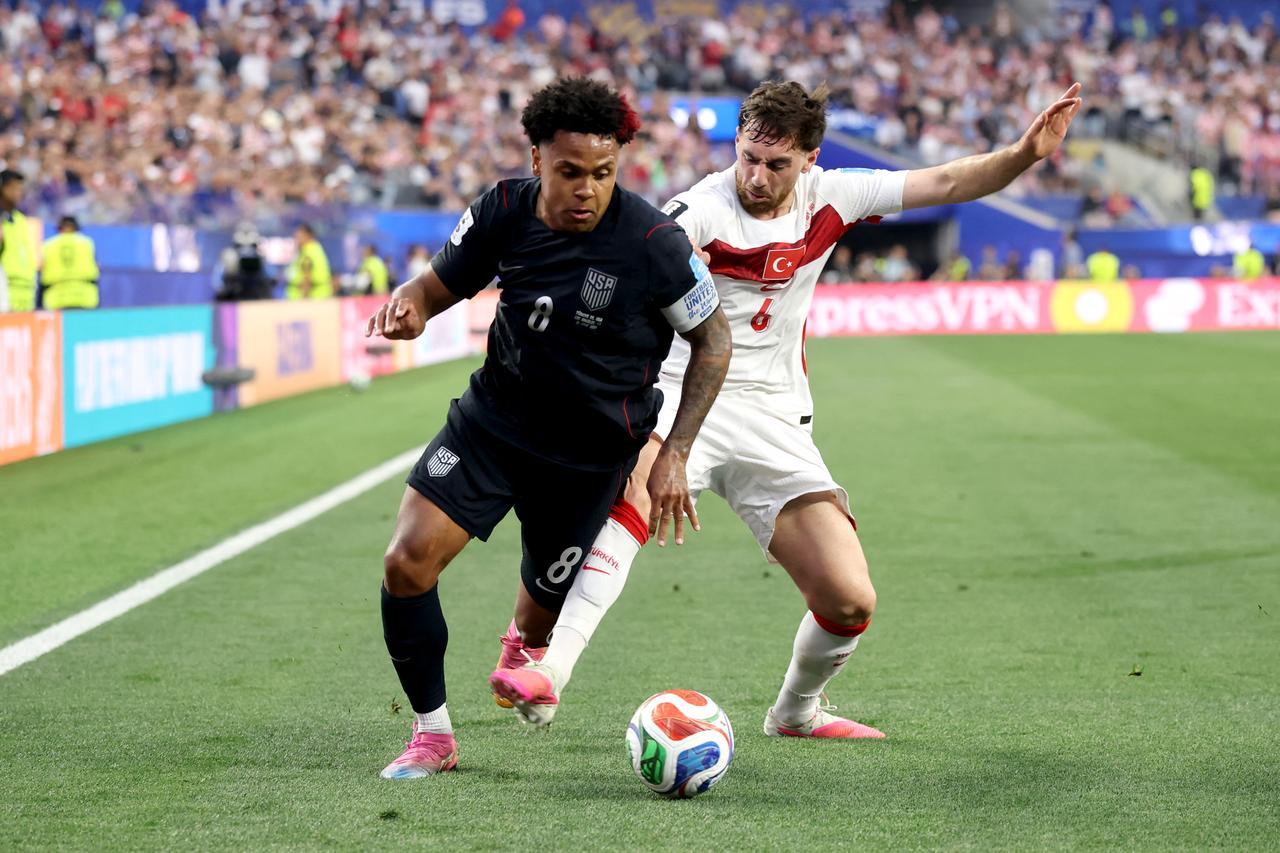 Weston McKennie #8 of the United States is challenged by Orkun Kokcu #6 of Turkiye during the FIFA World Cup 2026 Group D match between Türkiye and USA at Los Angeles Stadium on June 25, 2026 in Inglewood, California. (AFP Photo)