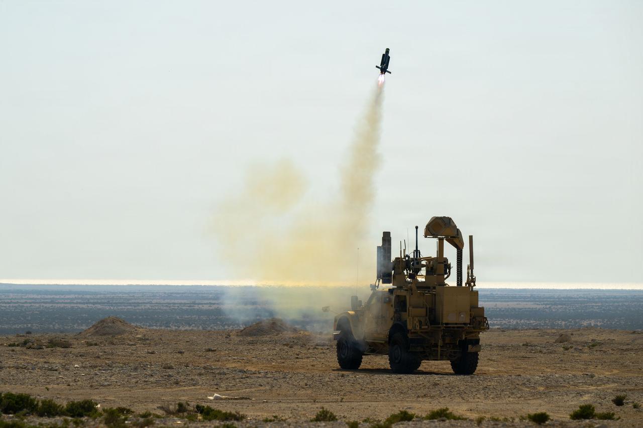 A mine-resistant ambush protected (MRAP) vehicle equipped with a mobile-low, slow, small-unmanned aircraft integrated defeat system (M-LIDS) launcher fires a counter-unmanned aerial system at a fixed wing target during a training exercise in Bahrain. (Photo via U.S. Navy)
