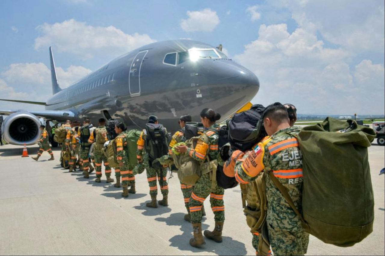 This handout image released by the Mexican Presidency press office shows Mexican Army personnel carrying gear as they line up to board a Mexican Air Force aircraft at Santa Lucia Military Air Base in the State of Mexico on June 25, 2026, before departing with humanitarian aid to Venezuela following deadly earthquakes.  June 25, 2026. (AFP Photo)