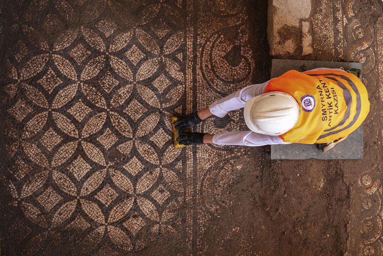 The mosaic features various geometric designs, including triangles, squares, and other patterns, as well as botanical motifs such as a heart-shaped ivy leaf that draws particular attention. Izmir, Türkiye, June 27, 2026. (AA Photo)