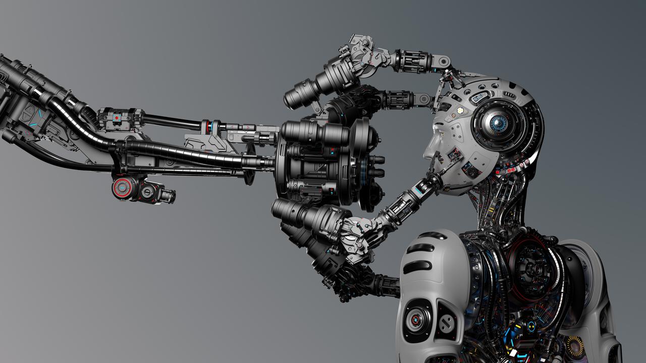 A humanoid robot uses a mechanical arm in an undated artificial intelligence-themed stock image. (Adobe Stock Photo)