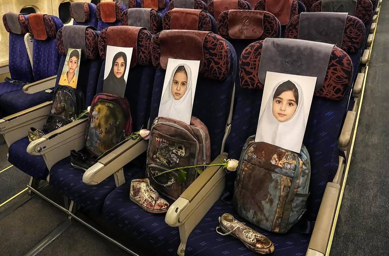 This handout photograph, taken and released on April 11, 2026, shows photos and belongings of the children killed in Madrasa Minab in Iran. (Photo by Iranian Ministry of Foreign Affairs/AFP)