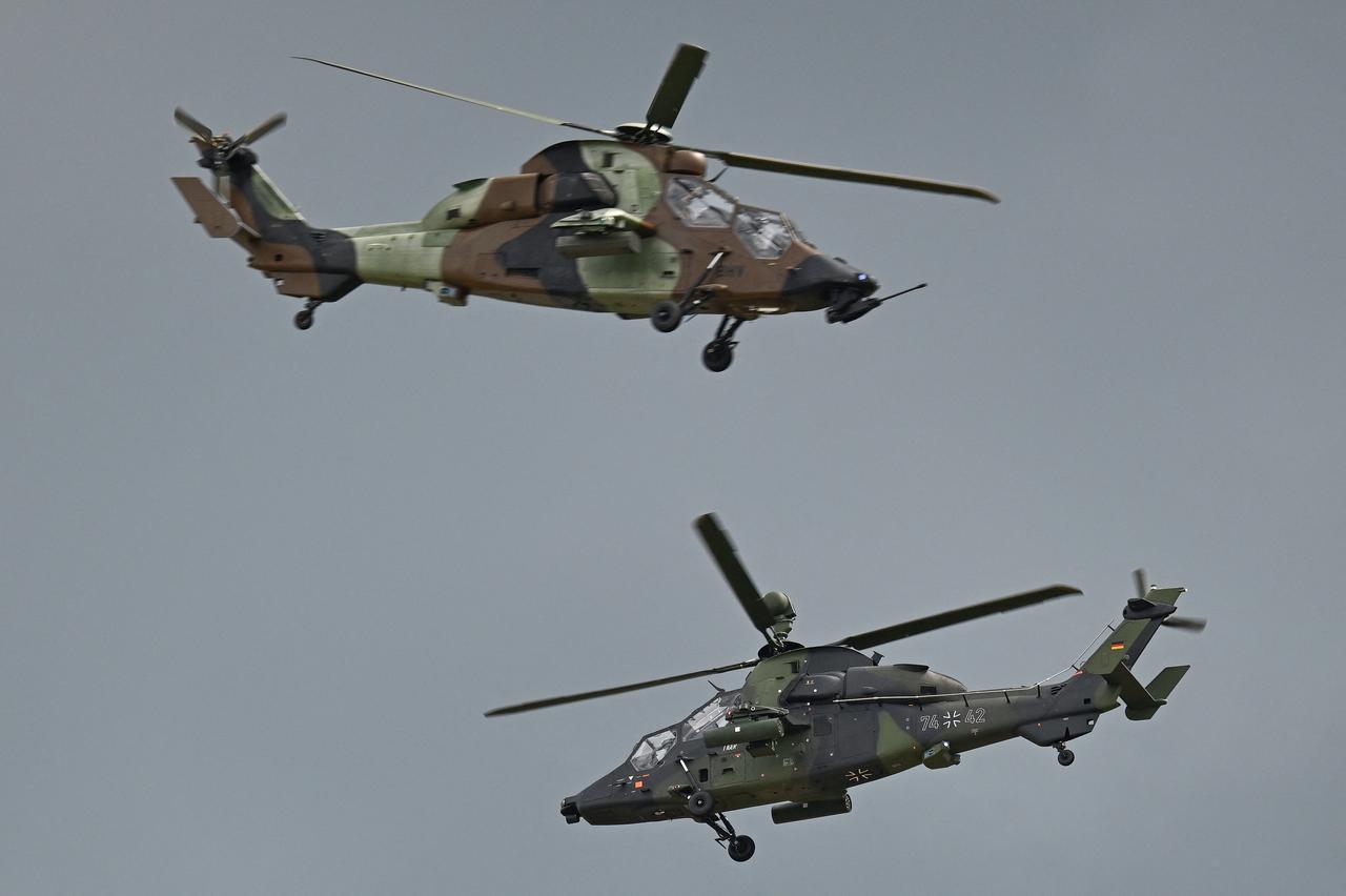 One French and one German Eurocopter EC665 Tiger attack helicopter show off their capabilities at the BER Airport in Schoenefeld, southeast of Berlin, June 11, 2026. (AFP Photo)