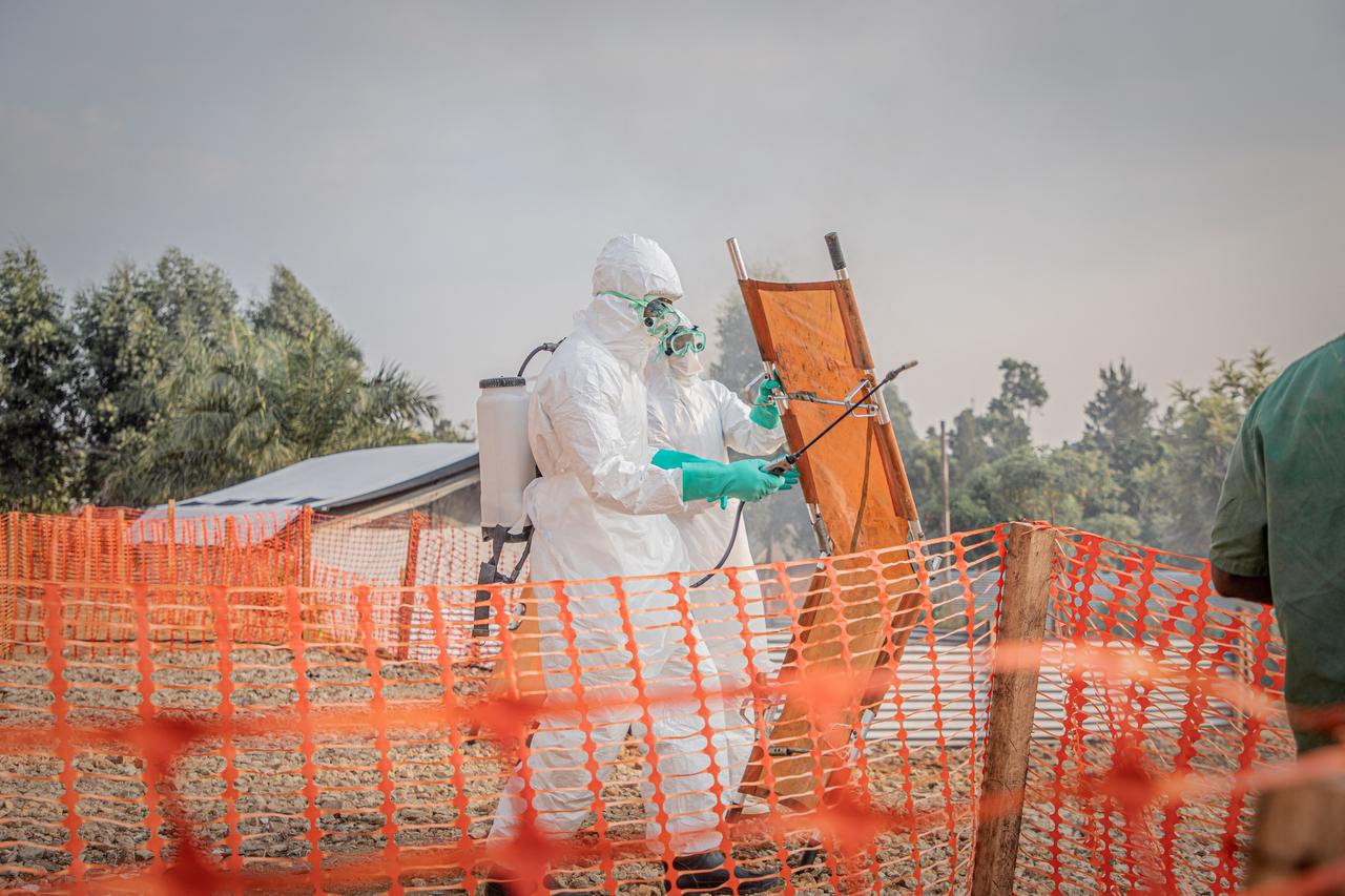 Healthcare workers disinfect a stretcher after transporting a patient suffering from the Ebola virus disease from an ambulance at the Ebola Treatment Center (ETC) in Bunia, Ituri, in the east of the Democratic Republic of Congo, June 23, 2026. (AFP Photo)
