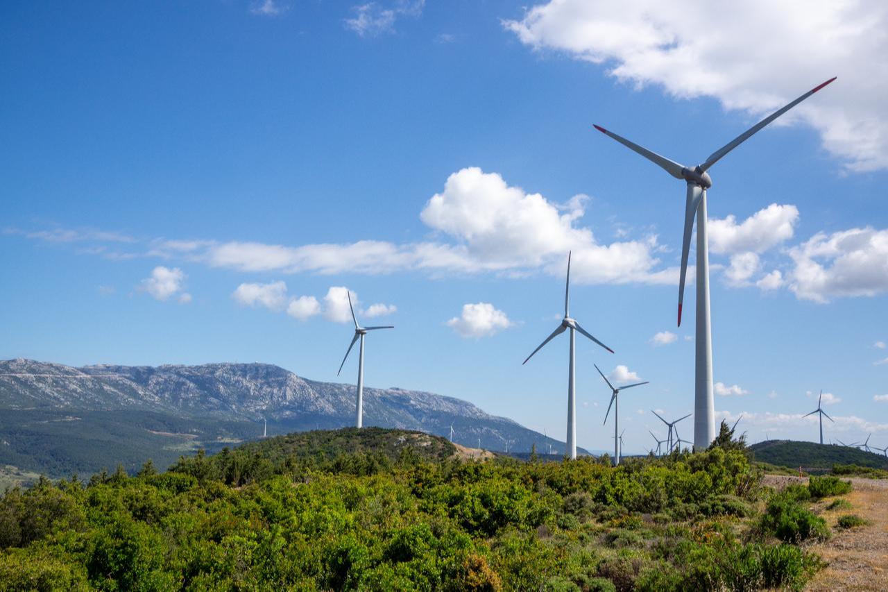 Wind turbines generate electricity at a wind farm in the hills of Izmir, Türkiye. (Adobe Stock Photo)