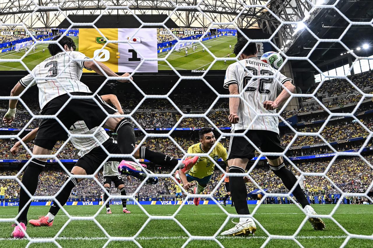 Brazil's midfielder #05 Casemiro (C) heads the ball and misses a goal opportunity  during the 2026 World Cup round of 32 football match between Brazil and Japan at the Houston Stadium in Houston on June 29, 2026.  (AFP Photo)