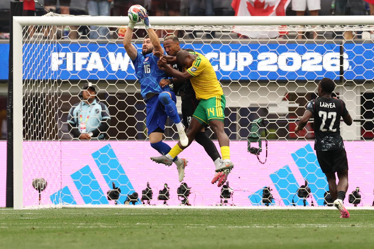 Canada's goalkeeper #16 Maxime Crepeau makes a save past Canada's defender #13 Derek Cornelius and South Africa's defender #14 Mbekezeli Mbokazi during the 2026 World Cup round of 32 football match between South Africa and Canada at the Los Angeles Stadium in Inglewood, June 28, 2026. (AFP Photo)
