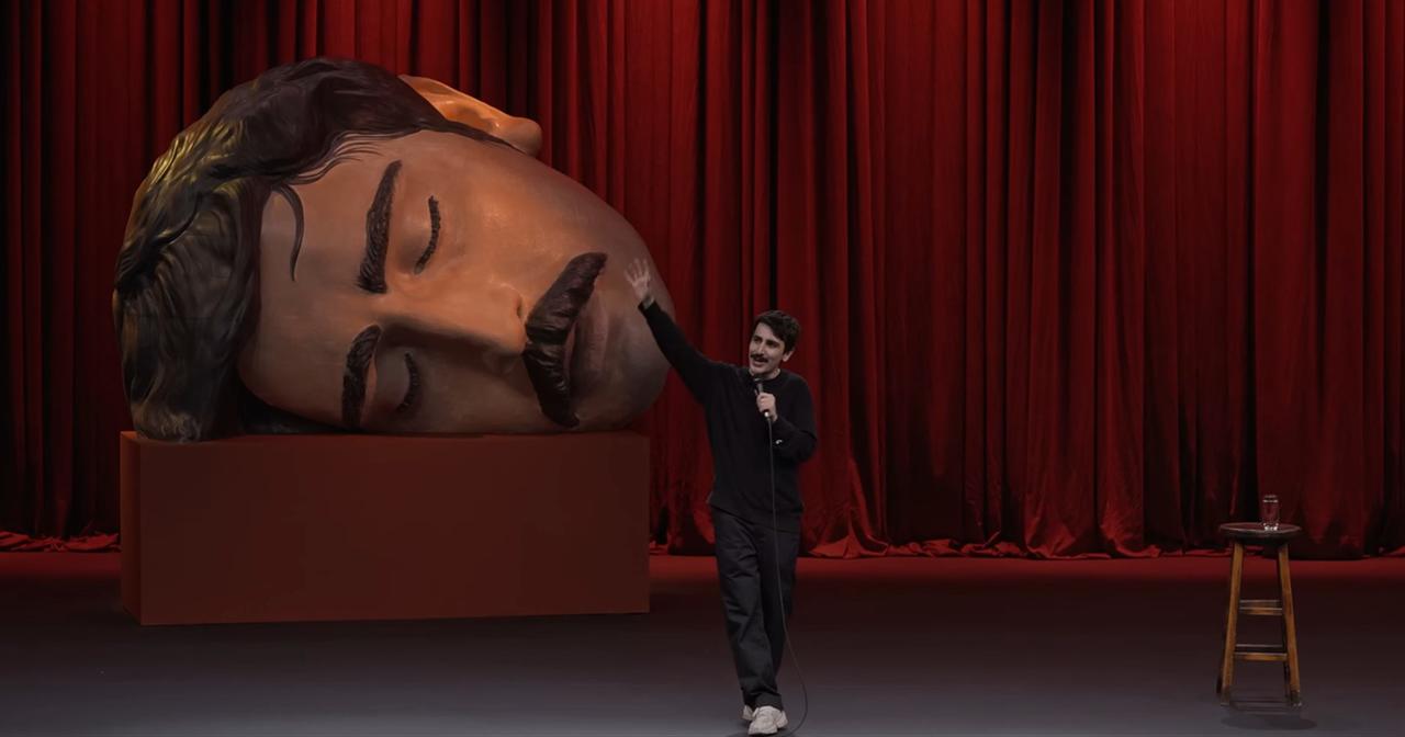 Deniz Göktaş performs during his stand-up show “Dead Deniz” in a 2026 YouTube screenshot. (Photo via YouTube)