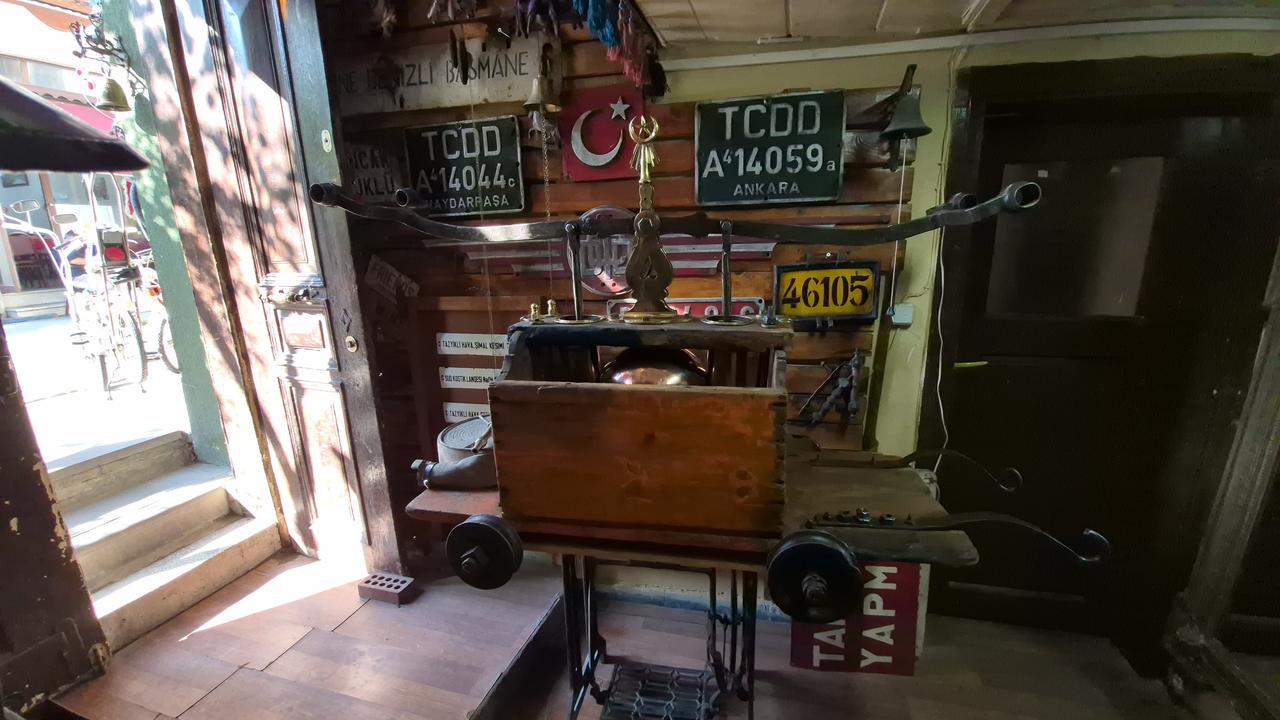 The nearly 300-year-old suction-and-pressure fire pump stands among antique railway signs and historical objects in Eskisehir’s Odunpazari district. (IHA Photo)