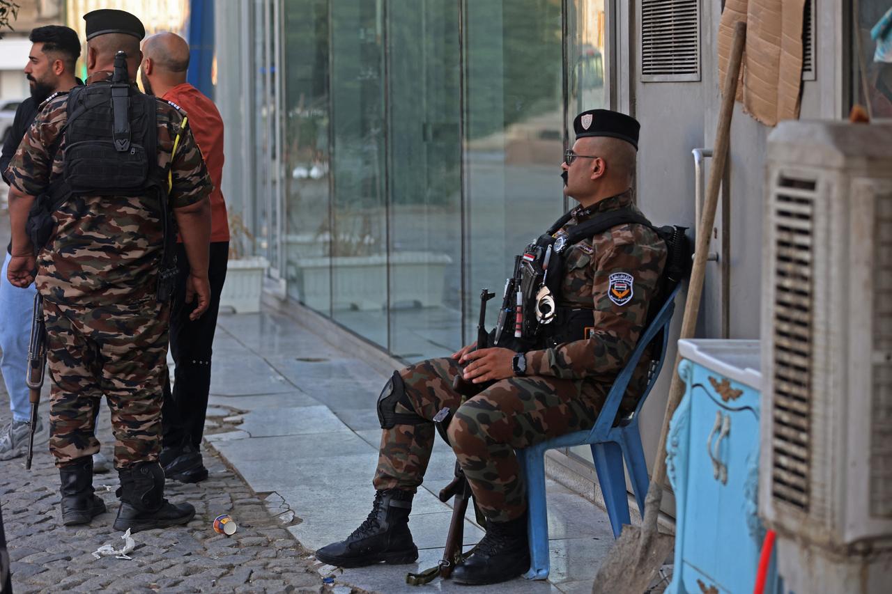 Iraqi security personnel guard a street in Baghdad on June 28, 2026. (AFP Photo)