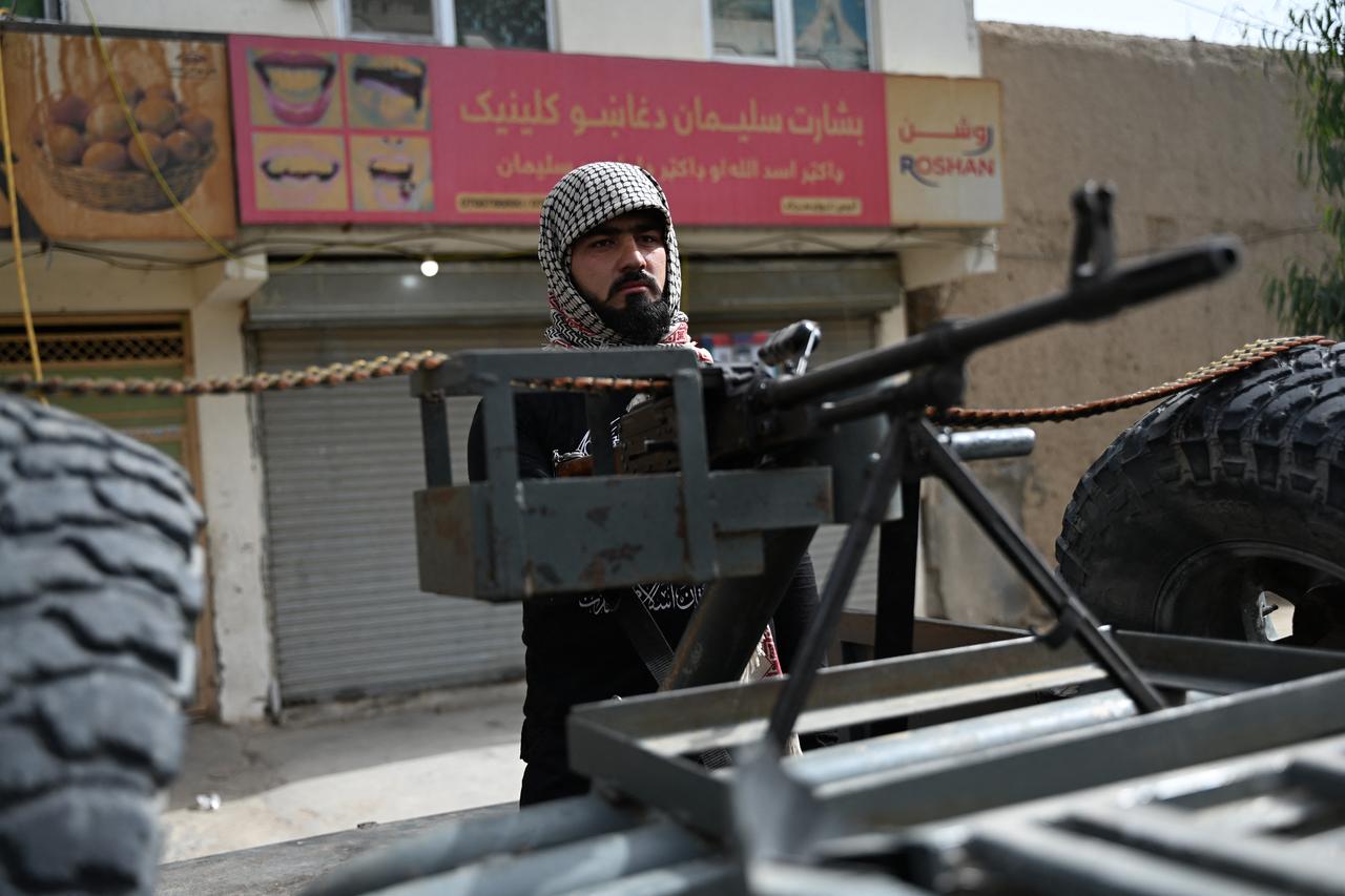 A Taliban security personnel stands guard along a road on the tenth day of Ashura, during the Islamic holy month of Muharram in Kandahar on June 26, 2026. (AFP photo)