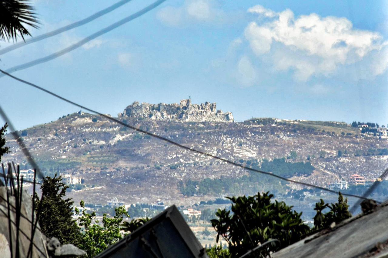The 12th century Crusader-era Beaufort (Belfort) Castle, known locally as Qalat al-Shaqif or Shaqif Arnun, is pictured from the town of Nabatieh in southern Lebanon, June 23, 2026. (AFP Photo)