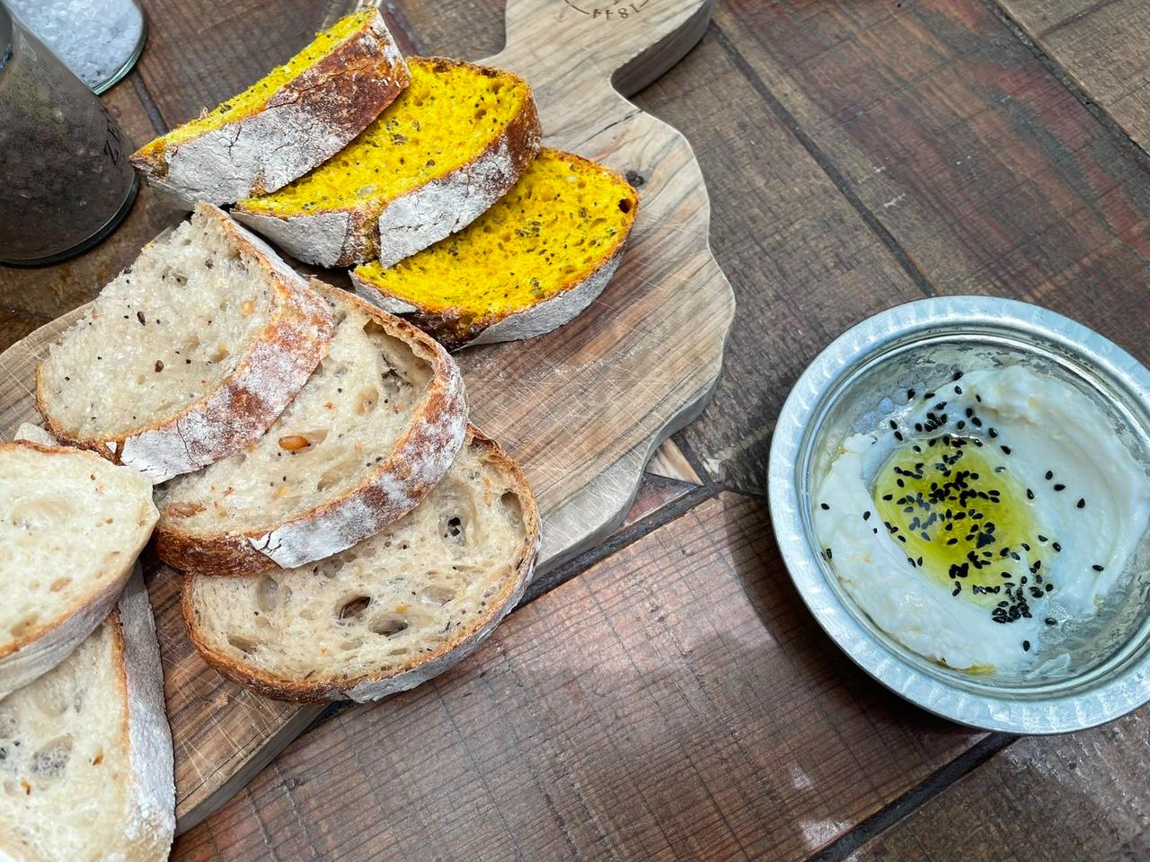 Sourdough bread and a yogurt-based dip are served as part of the Bursa tasting menu at Zennup 1844 in Bursa, Türkiye. (Photo by Koray Erdogan/Türkiye Today)