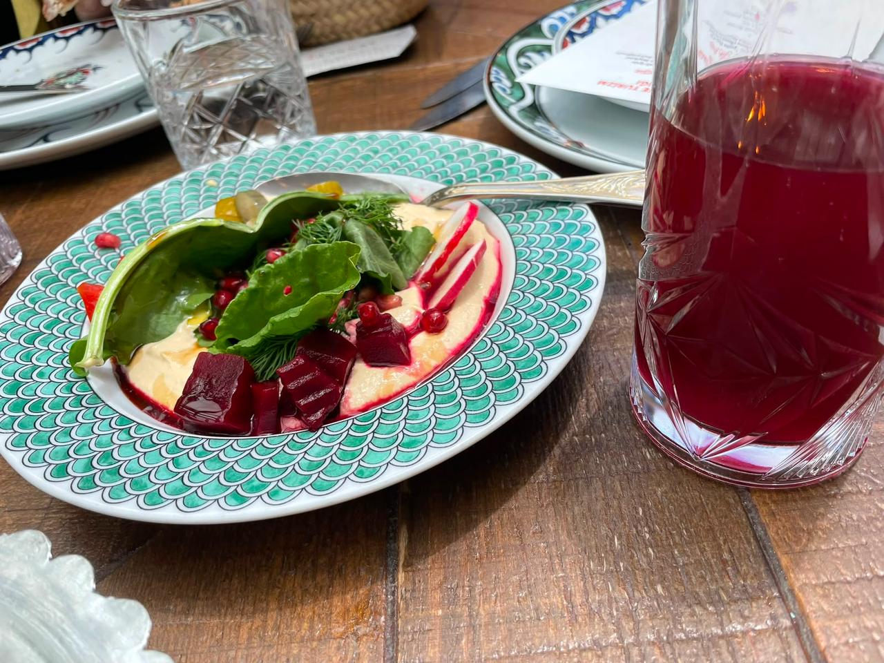 Humus-u Ala and a glass of reyhan serbeti are served together as part of the Bursa table at Zennup 1844 in Bursa, Türkiye. (Photo by Koray Erdogan/Türkiye Today)