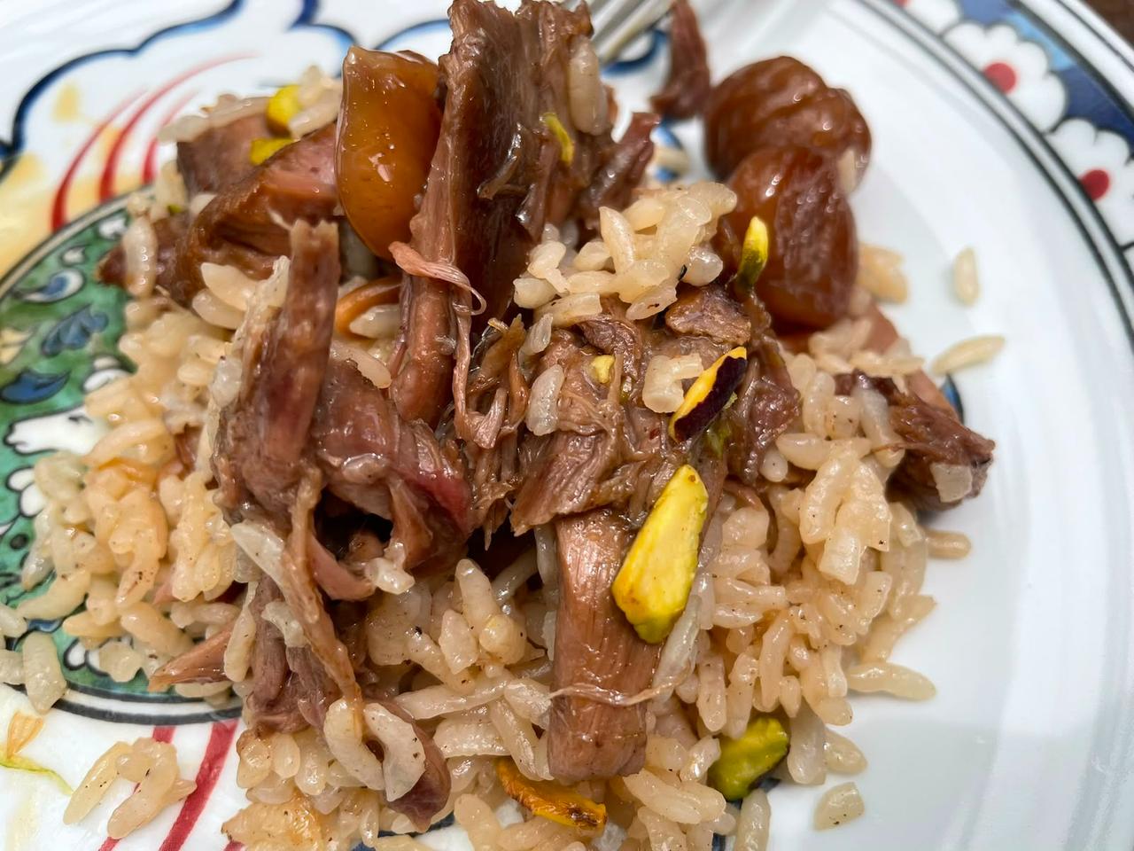 Kestaneli saray pilav, a rice dish topped with shredded meat, chestnuts and pistachios, is served during the Bursa tasting in Bursa, Türkiye. (Photo by Koray Erdogan/Türkiye Today)